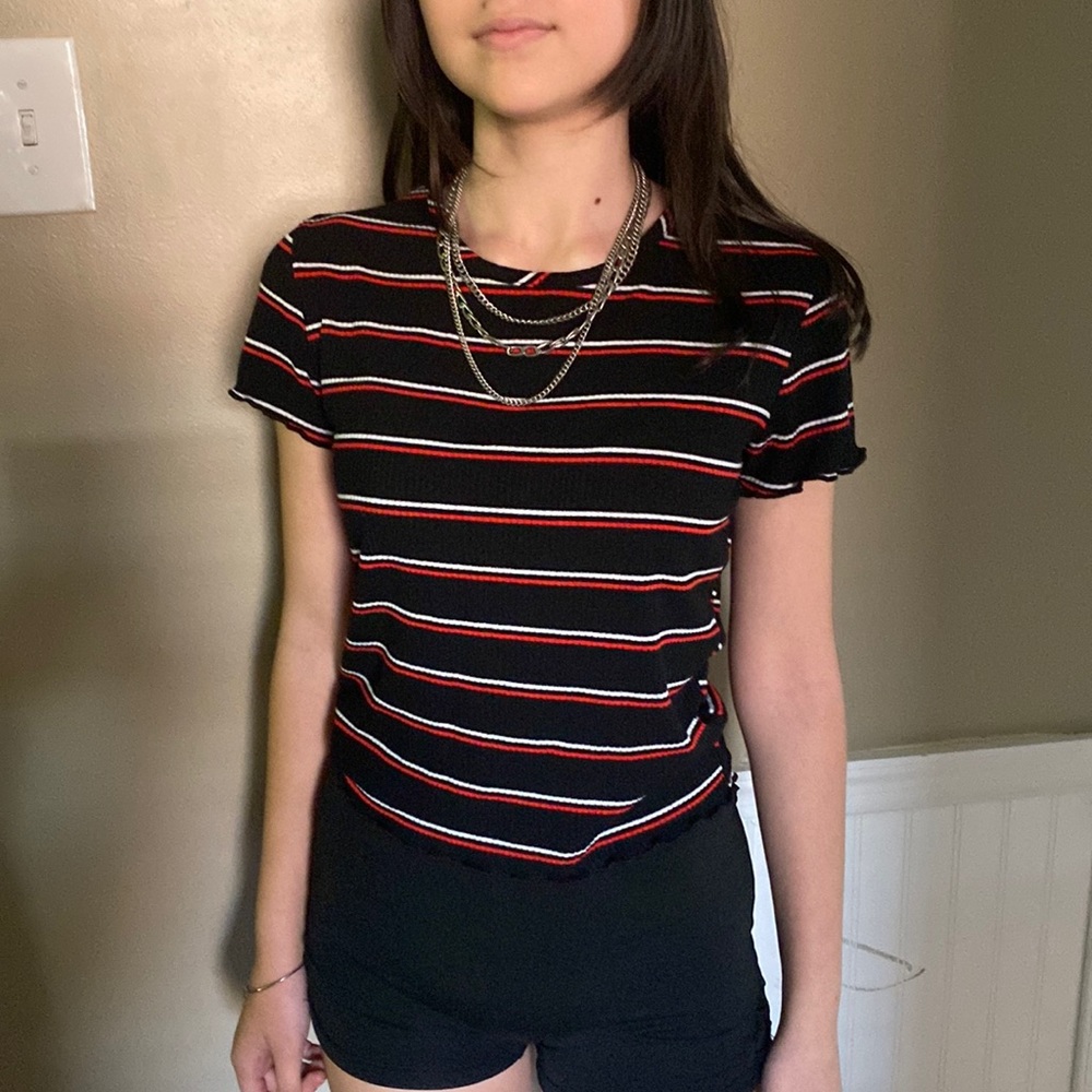 The tag says large but fits a little more like a medium.
